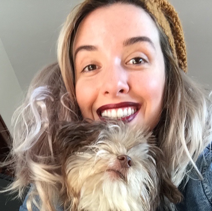 Woman (Marguerite) taking a selfie in the mirror, phone in hand, wearing a RHCP shirt.